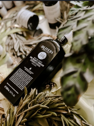 Oliveda botanical product surrounded by olive branches