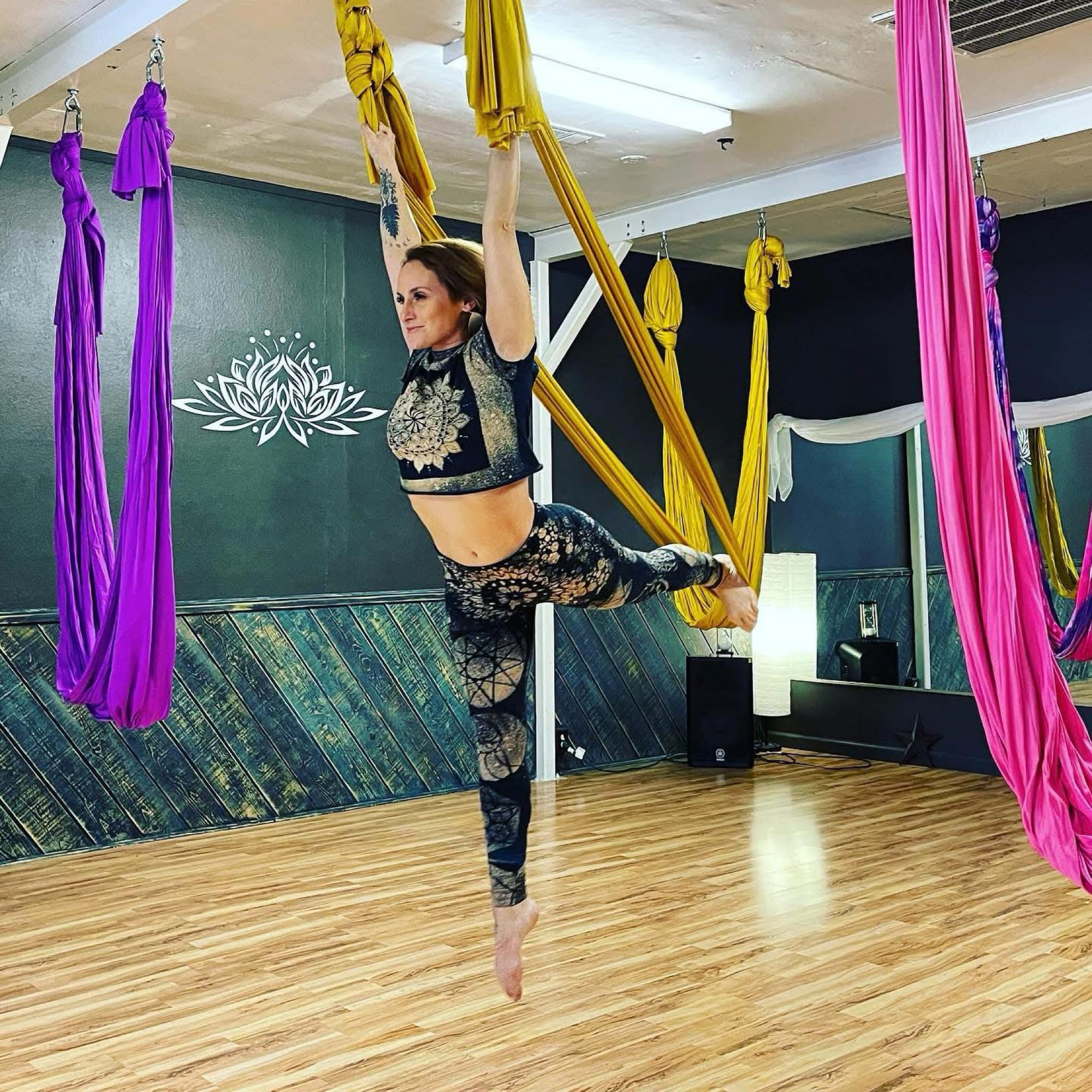 Christina Burton practicing aerial yoga